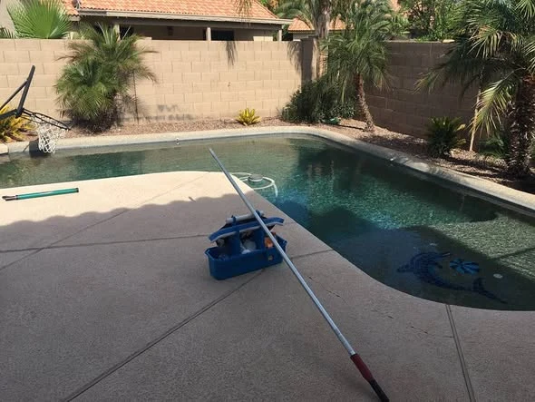 Poolside equipment beside a residential pool